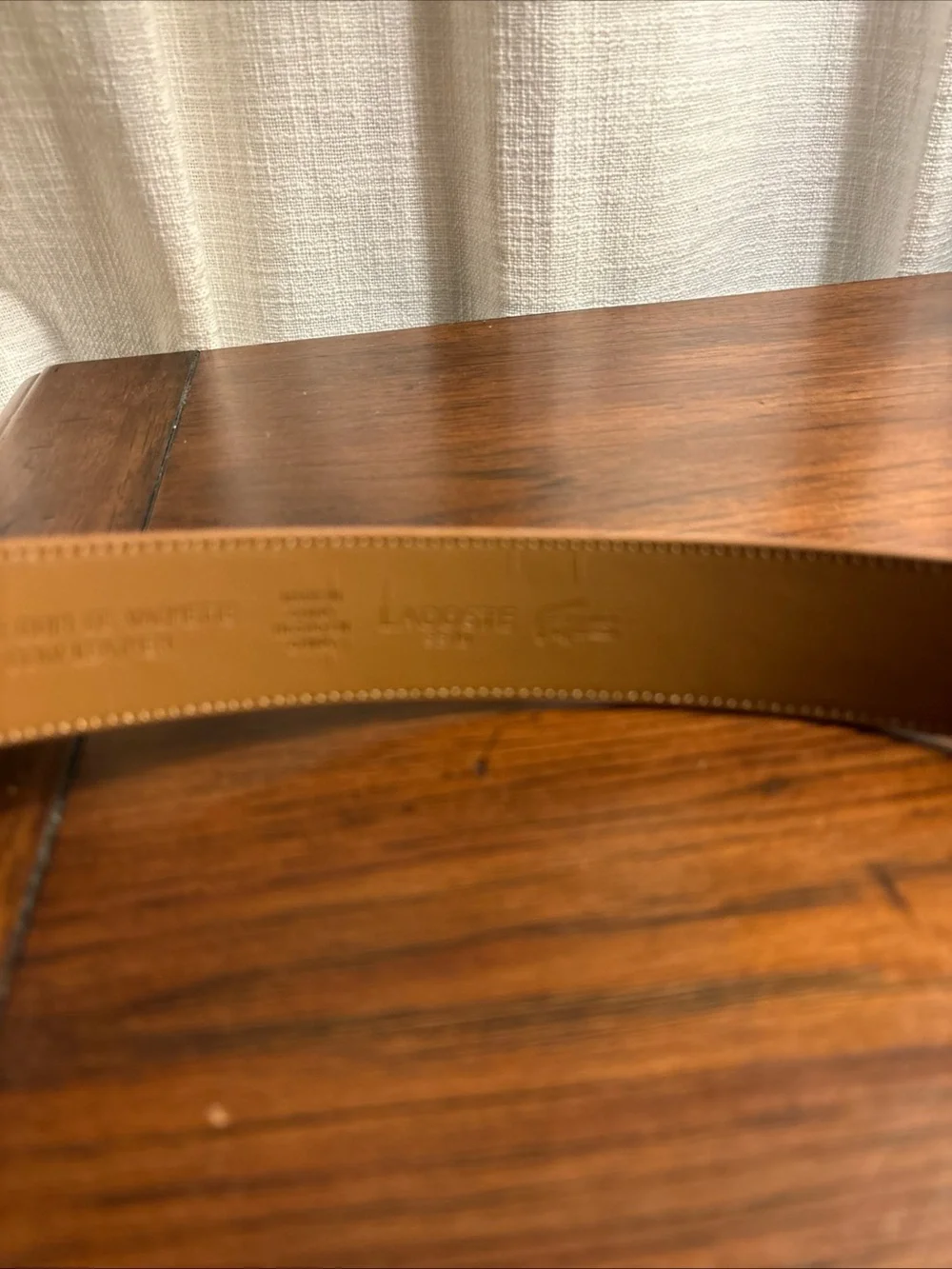 Tan Lacoste belt with textured weave pattern size 36